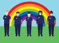 NHS hospital staff wearing face masks, standing in front of a rainbow