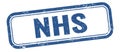 NHS text on blue grungy vintage stamp