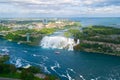 Niagara Falls. American falls. Boat with tourists moves along Bride Veil Falls. Canada, USA. Royalty Free Stock Photo
