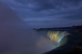 Niagara Falls lit at night by colorful lights Royalty Free Stock Photo