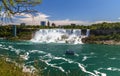 Niagara Falls, looking down the Niagara river. View of the river, observation tower, watefalls, cruise boats, city skyline. Royalty Free Stock Photo