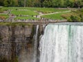 Niagara Falls, New York and Canada [ edge of Niagara falls, town from American and Canadian city side, falling water and mist ] Royalty Free Stock Photo