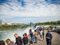 Niagara Falls, New York and Canada [ edge of Niagara falls, town from American and Canadian city side, falling water and mist ] Royalty Free Stock Photo