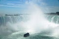 Niagara Horseshoe Falls with a touristic vessel Maid of the Mist approaching. The falls height is 57 m and they throw Royalty Free Stock Photo