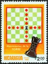 NICARAGUA - CIRCA 1983: A stamp printed in Nicaragua from the `Chess` issue shows rook movements, circa 1983. Royalty Free Stock Photo