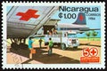 NICARAGUA - CIRCA 1984: A stamp printed in Nicaragua Red Cross airplane and ambulance, circa 1984.