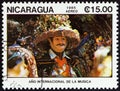 NICARAGUA - CIRCA 1985: A stamp printed in Nicaragua shows masked dancer in brimmed hat, circa 1985. Royalty Free Stock Photo