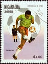 NICARAGUA - CIRCA 1982: A stamp printed in Nicaragua shows player kicking ball, circa 1982.