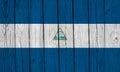 Nicaragua Flag Over Wood Planks