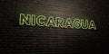 NICARAGUA -Realistic Neon Sign on Brick Wall background - 3D rendered royalty free stock image