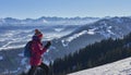 Active senior woman snowshoeing in in the Allgau alps above Immenstadt