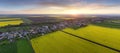 Nice aerial sunset landscape over yellow - green fields with rural village Royalty Free Stock Photo