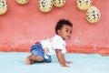 Nice african american boy healthy and happily starting to crawl