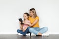 Nice App. Smiling Young Mother And Little Daughter Using Digital Tablet Together Royalty Free Stock Photo