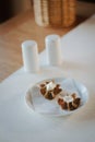 Nice appetizer snacks - tartlets on a white ceramic plate. Royalty Free Stock Photo