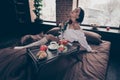 Nice attractive charming cute lovely sensual nude dreamy girl sitting on bed touching herself fresh rose enjoying Royalty Free Stock Photo