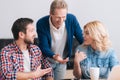 Nice attractive woman having a discussion with her colleagues Royalty Free Stock Photo