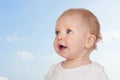 Nice baby with blue eyes with a beautiful sky Royalty Free Stock Photo