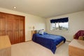 Nice bedroom in creamy tones with small bed, built in wardrobe