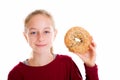 Blond girl looking through a big bagel Royalty Free Stock Photo