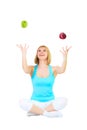 Nice blonde juggles apples Royalty Free Stock Photo