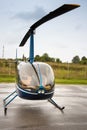 Blue helicopter near the field Royalty Free Stock Photo