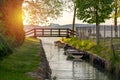 nice bridge with a small canal in Balatonbolar and fishng boats next to Lake Balaton