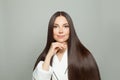 Nice brunette woman with long healthy straight hair on white background. Haircare concept Royalty Free Stock Photo