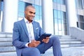 Nice businessman sitting on the stairs Royalty Free Stock Photo