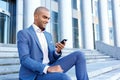 Nice businessman sitting on stairs Royalty Free Stock Photo