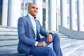 Nice businessman sitting on stairs Royalty Free Stock Photo