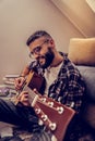 Nice cheerful man playing his favourite song Royalty Free Stock Photo