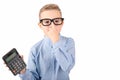 Nice child holding calculator. Portrait of funny cute schoolboy touching eye glasses.White background Royalty Free Stock Photo