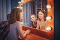 Nice children boy and girl near mirror