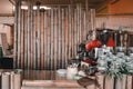 nice clean tidy and spacious cafe decorated with big bamboo poles with a red pot a coffee grinder and a variety of tea