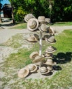 Nice closeup view of various fashionable summer straw hats on metal stand