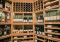 nice closeup view of various wine on wooden shelf`s inside cozy wine store
