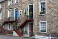 Nice colourful stairs to a front door at a stone house in Edinburgh