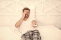 Nice comedy show. man watch tv. change channel by remote control in bed. happy man in pajama with remote control. guy Royalty Free Stock Photo