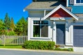 Entrance of new residential townhouse with concrete pathway with bushes in front Royalty Free Stock Photo