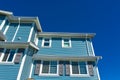 New residential townhouse on bright sunny day on blue sky background.