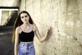 Nice and cool teen girl standing portrait on concreate place