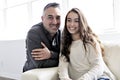 Teenager girl sitting on window with father Royalty Free Stock Photo