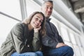 Teenager girl sitting on window with father Royalty Free Stock Photo