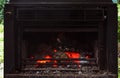 BBQ Barbeque on a nice summerday outside with natural wood. Fire burning in an oven outside stove. Royalty Free Stock Photo