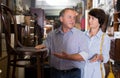 Nice couple is shopping the old armchair Royalty Free Stock Photo