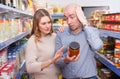 Nice couple holding preserved goods Royalty Free Stock Photo