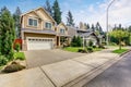 Nice curb appeal of American two story house with perfect landscape design.