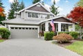 Nice curb appeal of grey house with covered porch and garage Royalty Free Stock Photo