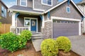 Nice curb appeal of two level house, mocha exterior paint and concrete driveway